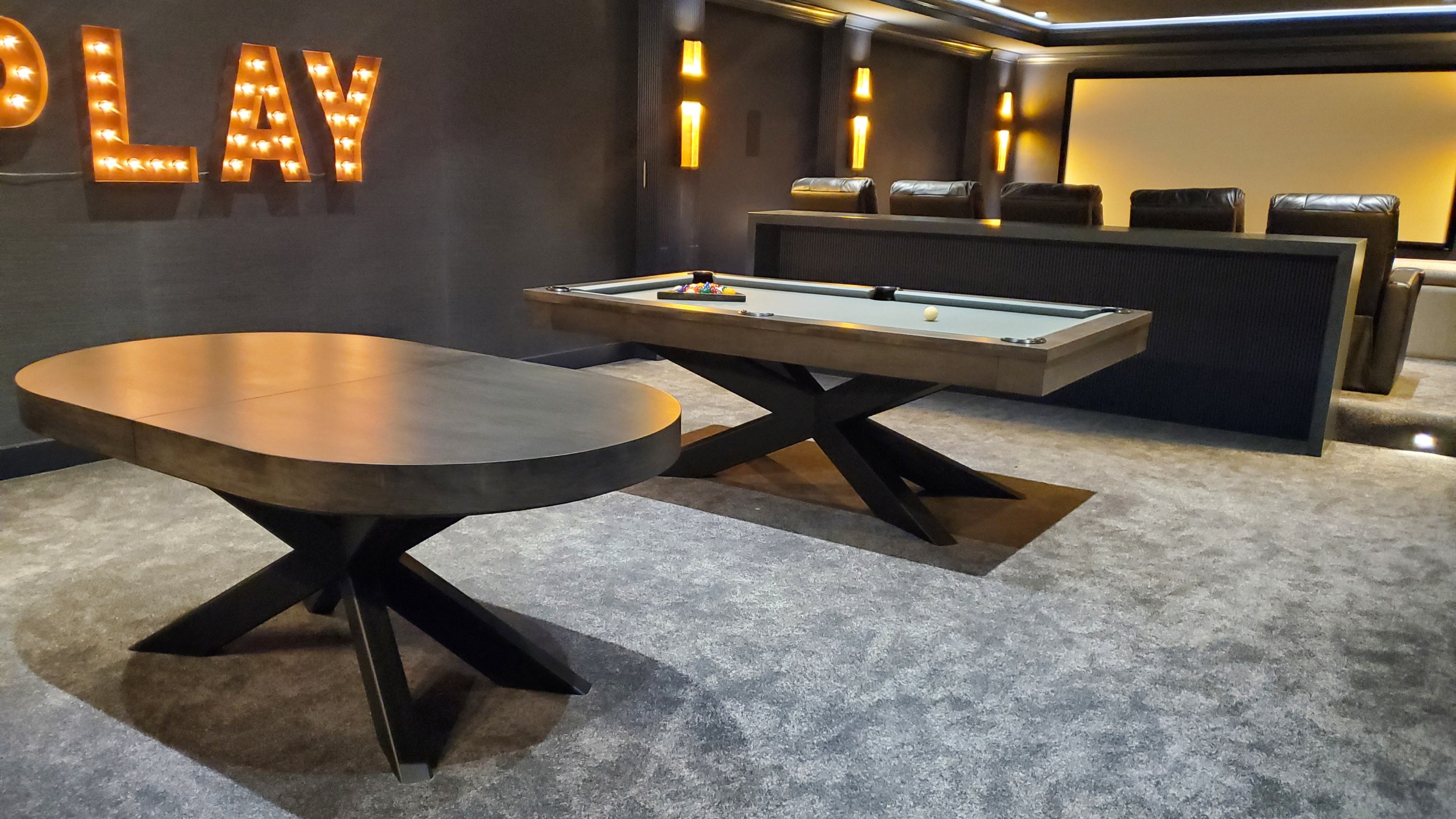 Game room with pool table and 'PLAY' sign on wall1621243260e1af0c20-1