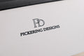 Close-up of a product with 'Pickering Designs' logo on a white surface.