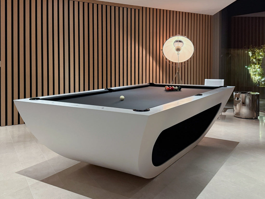 Modern pool table in a stylish room with wooden paneling.