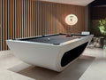 Modern pool table in a stylish room with wooden paneling.